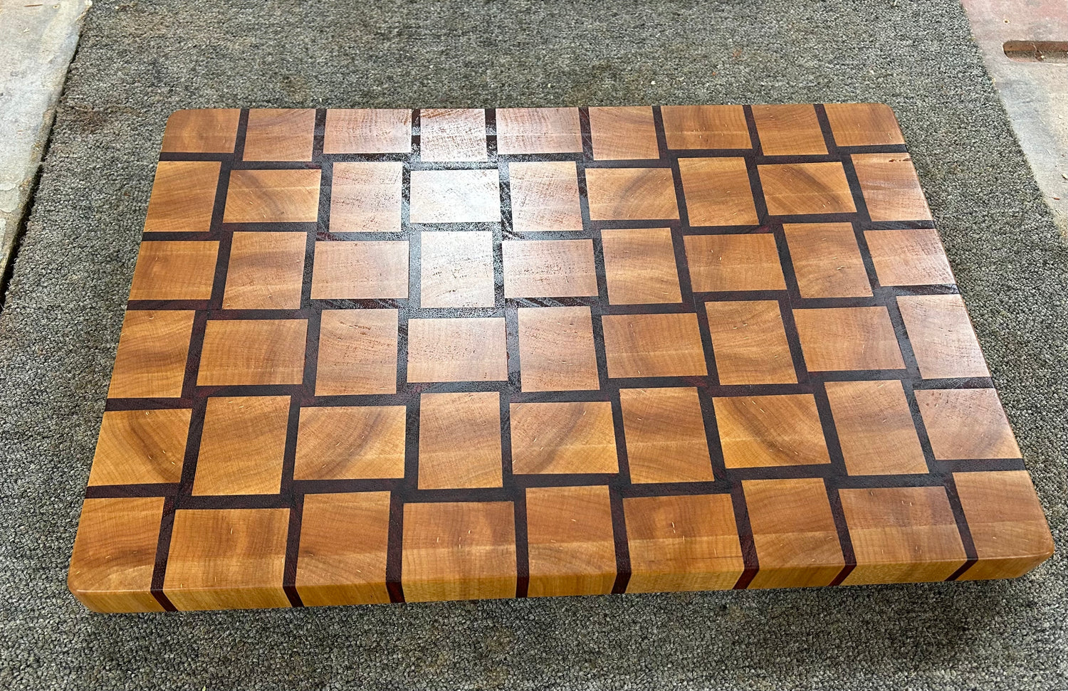 heirloom basket weave end grain cutting board on countertop