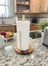vertical wooden paper towel holder on countertop